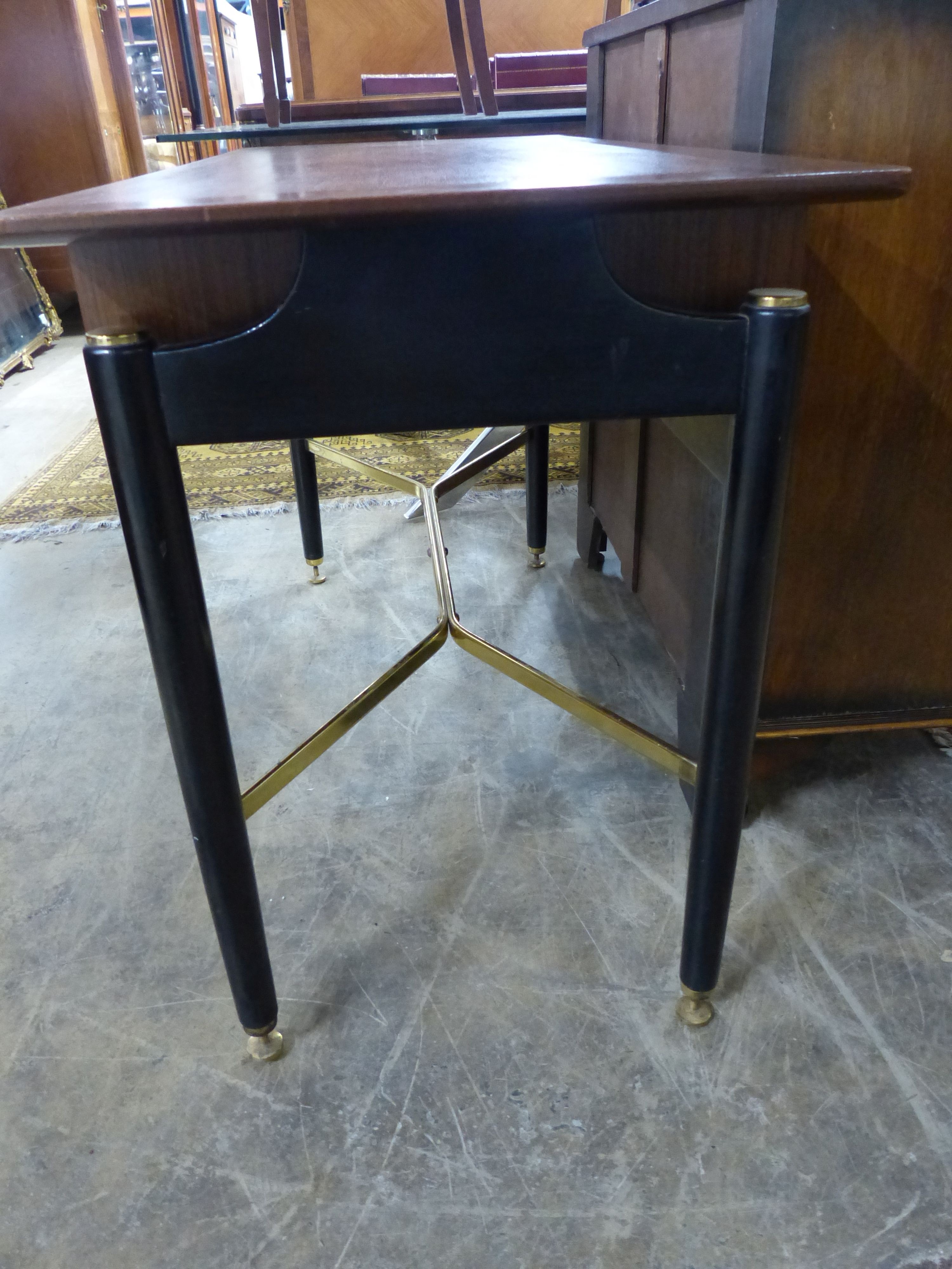 A G plan part ebonsed teak two drawer side table with brass X stretcher, W 120 D 52 H 75 cms.